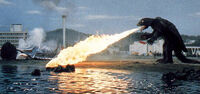 Gamera breathes fire at .