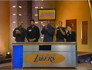 The champion Lakers have dark shirts on.