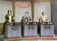 Another shot from the same 1974 show. When it was a contestant's turn, the display lit up respectively. Note also the use of slide projection displays for the scoreboards.