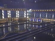 The 2006 Celebrity Jeopardy! set from Radio City Music Hall, similar to the Million Dollar Masters set at the same location. There are two doors; the right one is for the celebrities and the one on the left is for Alex.