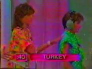 The women are playing the word "TURKEY".