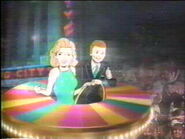 Cartoon Pat and Vanna ride in their Wheel spaceship soaring into our lives!