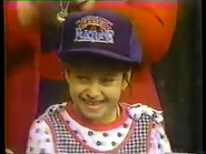 this adorable little cutie wearing a "Fame & Fortune" hat