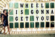 From the "Wheel is Gonna Get You" televised promos from the early 90's. "WHEEL'S ON!"