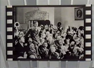 Looks like someone revealed the picture! This is a picture from the movie Mr. Deeds Goes to Town.