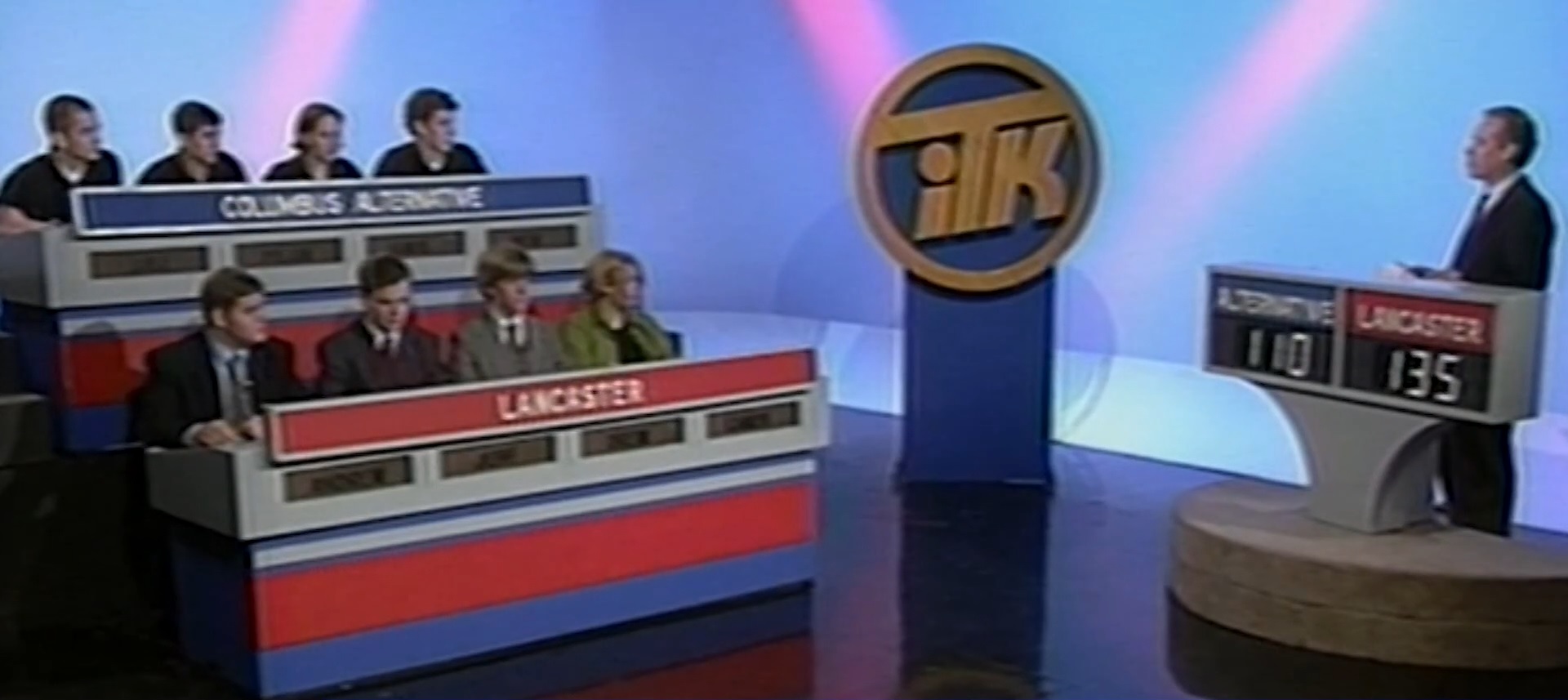 From 1995 to 2007 (seasons 31-42), In The Know featured a brighter blue and pink backdrop, and the carpet was removed from the student podiums to modernize the look. Bill Schiffman's hair gradually changed to a whitish gray color over the years, but it was still mostly black. The student podiums got a white paint job with blue, white, and red stripes. Bill Schiffman's podium also got a white paint job. The ITK logo was on a podium stand next to the host and student contestants. Also on the set, a brighter blue backdrop was used behind Schiffman. At the end of each episode, host Bill Schiffman left his podium, walked over to the student podiums, chatted with the contestants, then the camera zoomed in for a close-up of the ITK logo as the credits rolled.