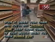 There goes Team 2 to find the clue! Stick it under your chair and you'll see "trouble come" keep those cubes in your mouth when you chew Bubble Yum!