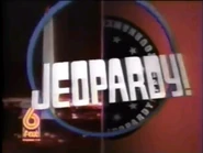 Screenshot A from the promo. Note that the Jeopardy! Logo is silver.