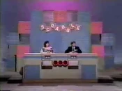 The Crossword Contestant Area, with its medley of salmon and periwinkle colors, and a "SCRABBLE" sign at the top.