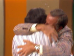 Gene and Mclean sharing a hug