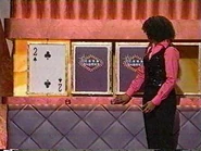 A three-card game in progress.