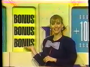 Diane (Detroit's version of Vanna White) gestures towards the BONUS card reveal meaning a contestant has a chance to win a Brand New Car (two of the contestants won Cars)