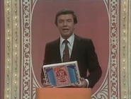 Art holding a "mock-up" box of the SUPER PAY CARDS home game.