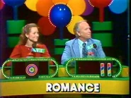 Player podiums from the pilot. One guess with the bullseye, two guesses with the candy sticks. Also in the pilot, the word is displayed on the contestant's podium as opposed to the screen.