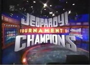 Tournament of Champions title card from Season 14. Note that the set is in the background, and the logo is behind the contestants, allowing for a wide shot when cutting from a clue to the contestants.