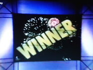 In Season 2, if you bet your debt correctly, the 9-screen video wall would display "WINNER" behind the fireworks.