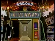 the correct key was the "Red" (1) key as Aggie unlocks the safe to reveal the $50,000 check.