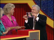 Richard holding up a picture of his daughter Shannon Nicole.