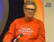 Charles Nelson Reilly wearing a red "A Mark Goodson Production" sweater on Match Game '90.