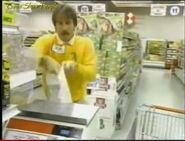 A contestant measuring candy in 1993. Note that the readout, in front of the scale, was smaller than the large LED display later on.