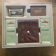 It included more game cards than a standard game, a "leatherette" point wheel and either white (seen here) or woodgrain-style (also used in the "Collectors Edition") card wallets. It also included a deck of "Lightning Round" Bonus Game cards and a 60-second sand timer with which to play the bonus.