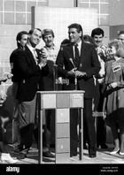 Scrabble All-American Tournament champion Mark Bartos with host Chuck Woolery and 1st runner-up finalist Ginger James