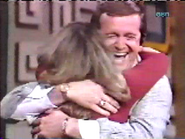 Bill Anderson hugs a very happy contestant after he helps her win.