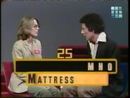 Here's another playing but with the entrance in the background. Here's future Super Password host Bert Convy giving the clues.