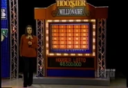 Catt and the board. Under the main board is a tote board which displayed jackpots for the Hoosier Lottery.