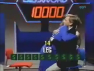 Patricia hugs Pat Sajak after he helps her win $10,000. This was the first bonus round win, coming on the second episode of premiere week. During the first few weeks, the set’s neon lights would flash upon a bonus round win, and the passwords were colored in white.