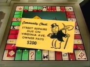 Another Community Chest Card. There are Street repairs due; however, the card states how much you have to pay regardless of how many hotels or houses you have; the board game has you pay $40 per house and $115 per hotel.