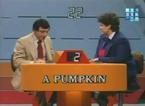 Jamie Farr and a contestant playing the main game from 1985.