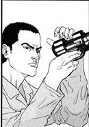 Togo examining one of the Gantz guns