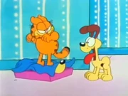 Someone in My Bed: Garfield sees and greets Odie while stomping what he thinks is Odie.