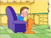 Linoleum Curl: Garfield and Jon watch the linoleum curl.