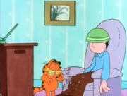 Quiet Evening 2: Garfield grins evilly at the chaos he has created.