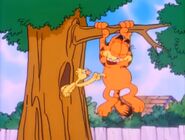 and pokes Garfield's tummy...