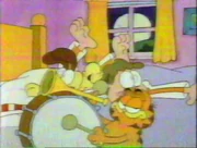 Wide Awake: Garfield wakes up Jon & Odie early in the morning.