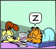 6/17/1994 Odie grins evilly and sets a glass of dentures next to Garfield.