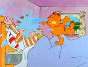 Water Wake-up: Garfield wakes up a sleeping Jon by spouting water on his face.