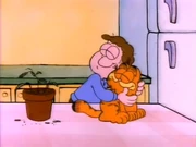 The Right to Be a Cat: Garfield and Jon hug before Jon asks what happened to his fern.