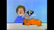 Asleep: Jon plays a practical joke on Garfield.
