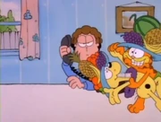 Normal: As he dances with Odie, Garfield tells Jon that they need more fruit.