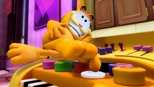 Garfield has some fun by pressing sound effects buttons with his toes.