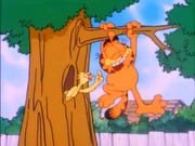 Garfield laughs as a bird tickles him.