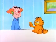 Different About Me: Garfield points out the clown face he put on Jon.