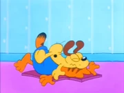 Wonderful Dream?: Odie lands on Garfield after the latter punted the former.