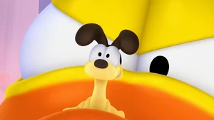Odie realizes he is on the beak of a monstrous rubber ducky.