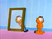 Two Self: Garfield pauses when his reflection secretly stares at him.