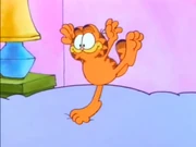 On to the Stage: Garfield hops on Jon's bed, pretending to play hopscotch.